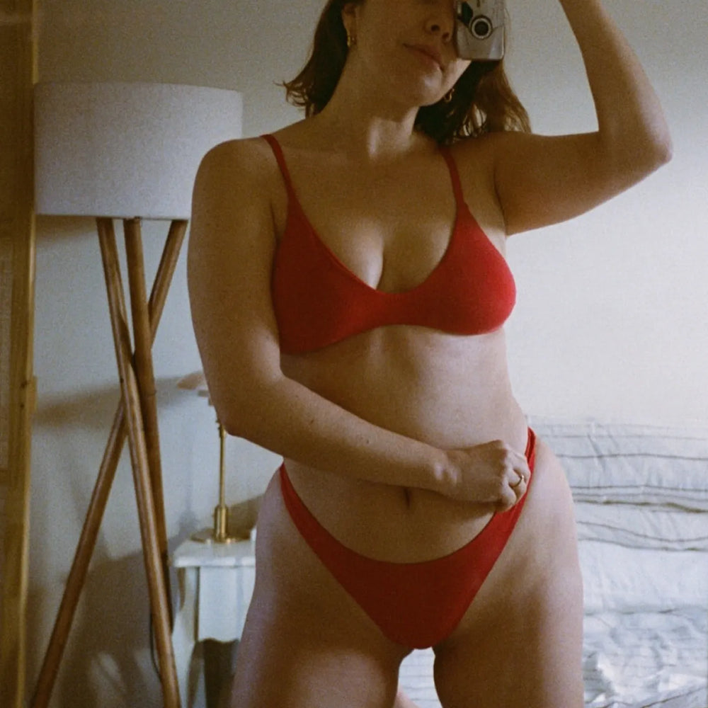 Ganyah G wearing the Stella Low Cut Bra in Chilli in a mirror portrait